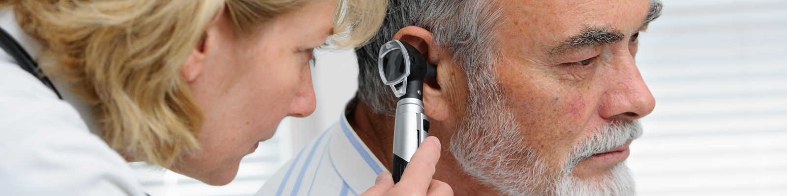impacted ear wax symptoms