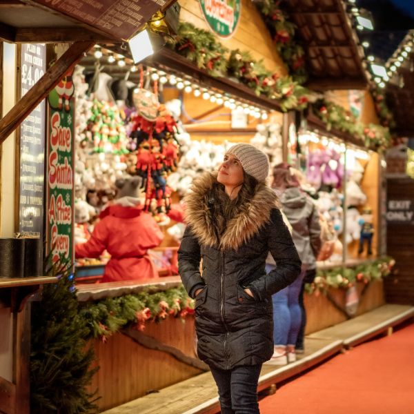 Woman walking around Christmas markets