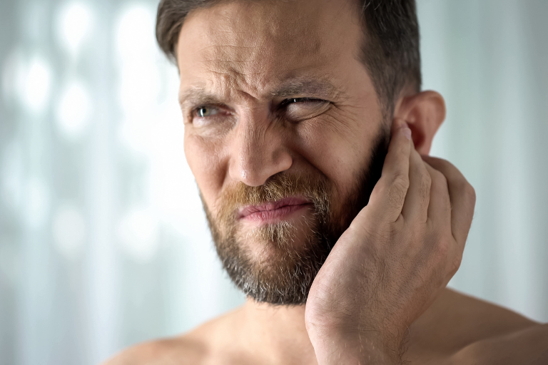 Man with an itchy ear