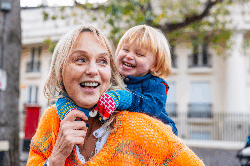 Woman enjoying the sound of her child's laugher.